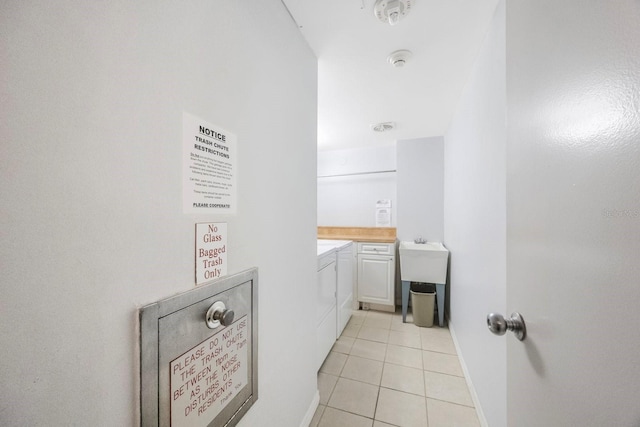 bathroom featuring baseboards and tile patterned floors