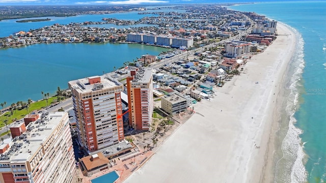 aerial view featuring a view of city, a beach view, and a water view