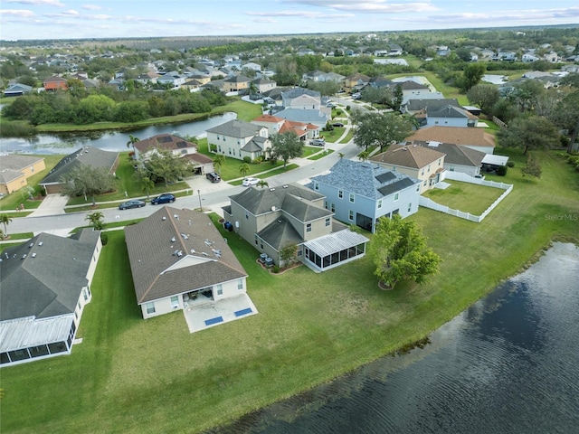 aerial view with a residential view and a water view