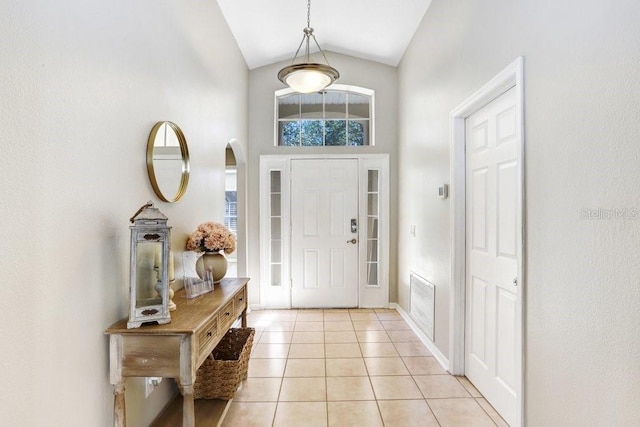 tiled entrance foyer with lofted ceiling