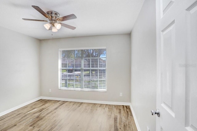 spare room featuring ceiling fan and light hardwood / wood-style floors