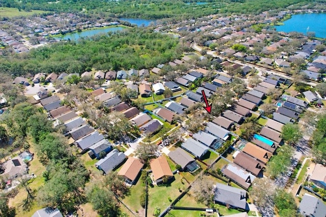 drone / aerial view with a water view