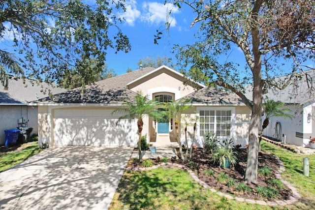 single story home featuring stucco siding, concrete driveway, and an attached garage