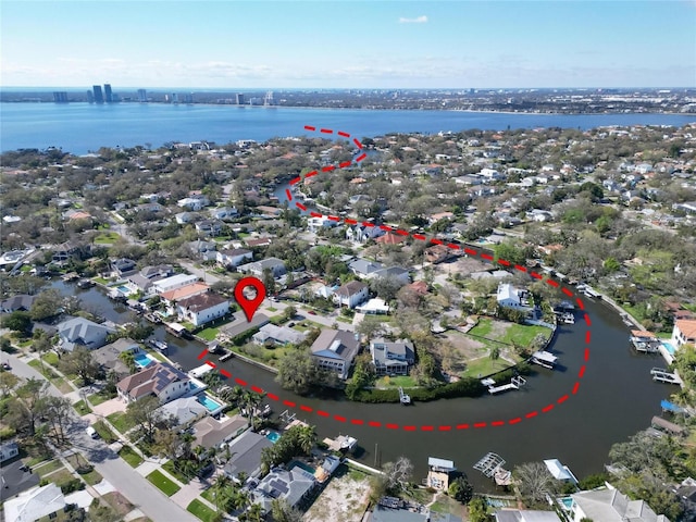 aerial view featuring a residential view and a water view