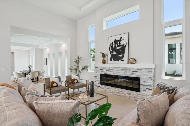 living room featuring a towering ceiling