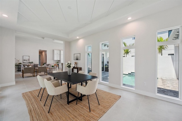 dining space featuring light tile patterned floors