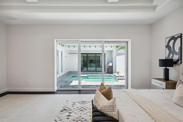 tiled bedroom with access to outside