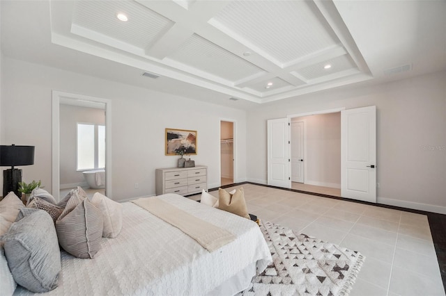 bedroom featuring coffered ceiling, light tile patterned floors, beam ceiling, and a walk in closet