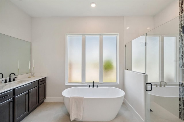 bathroom with tile patterned floors, vanity, and independent shower and bath