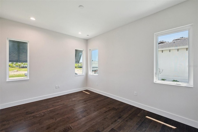 unfurnished room featuring dark hardwood / wood-style flooring