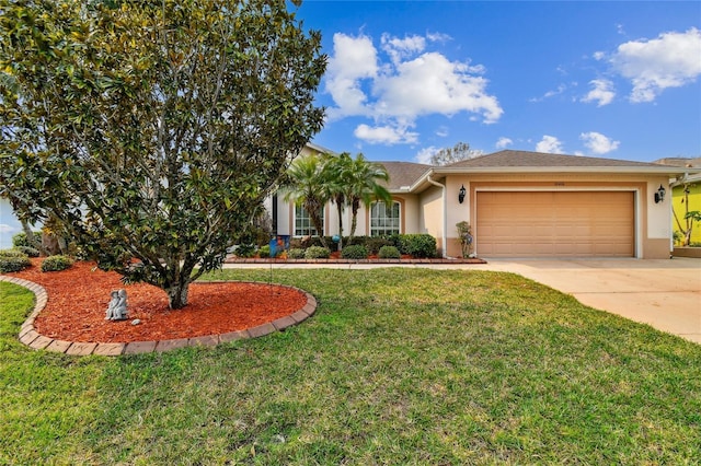 view of front of property with a front yard and a garage