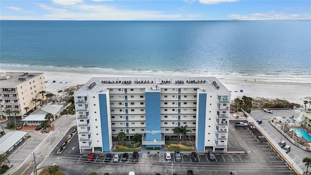 birds eye view of property featuring a water view and a view of the beach