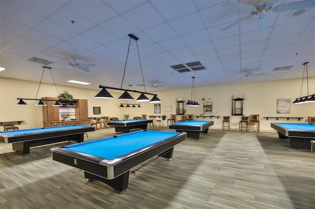 recreation room with a paneled ceiling, ceiling fan, carpet floors, and pool table