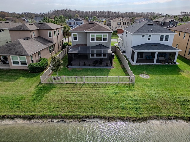 birds eye view of property with a residential view and a water view