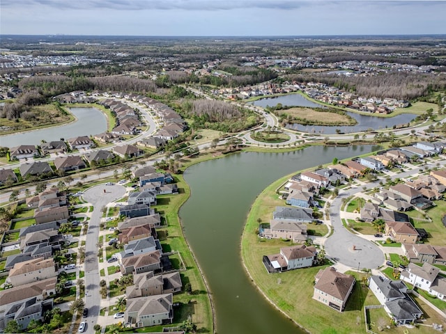 drone / aerial view featuring a water view and a residential view