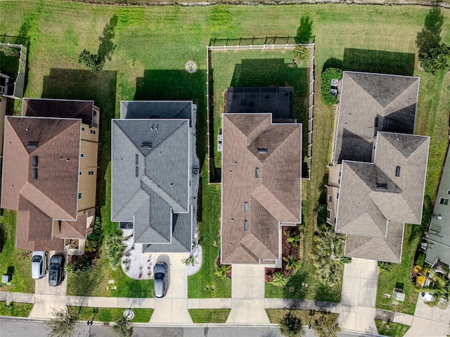 birds eye view of property with a residential view