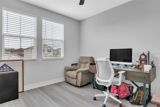 office space featuring light wood finished floors and baseboards