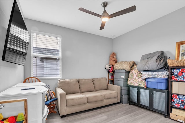 interior space with light wood-style floors and a ceiling fan