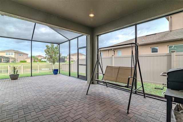 unfurnished sunroom featuring a residential view