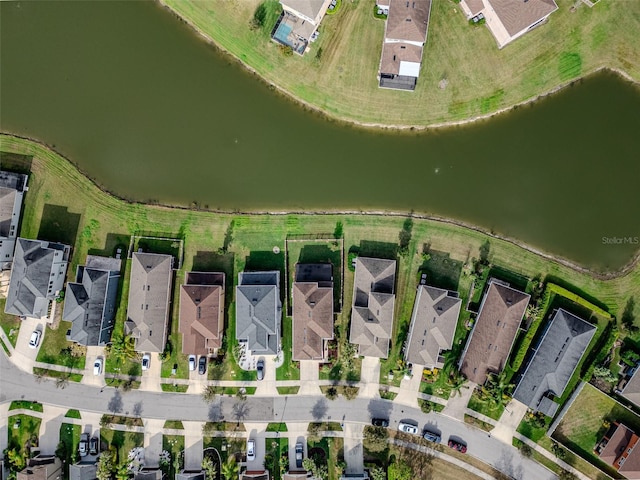 drone / aerial view with a residential view and a water view