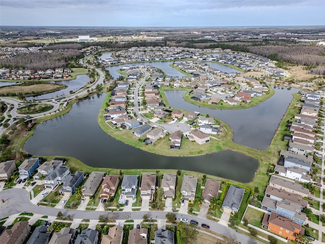 bird's eye view with a residential view and a water view