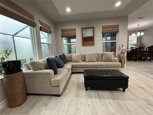 29011 Trevi Pl, Wesley Chapel, FL 33543 - living room with a chandelier, light wood-type flooring, and recessed lighting