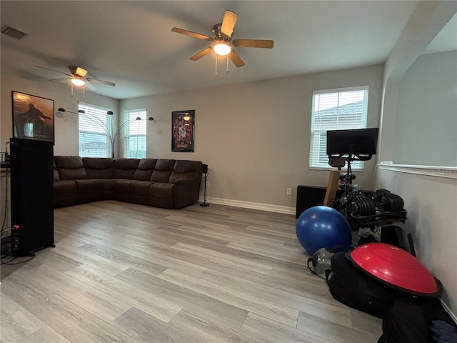 29011 Trevi Pl, Wesley Chapel, FL 33543 - living area featuring a ceiling fan and light wood-style floors