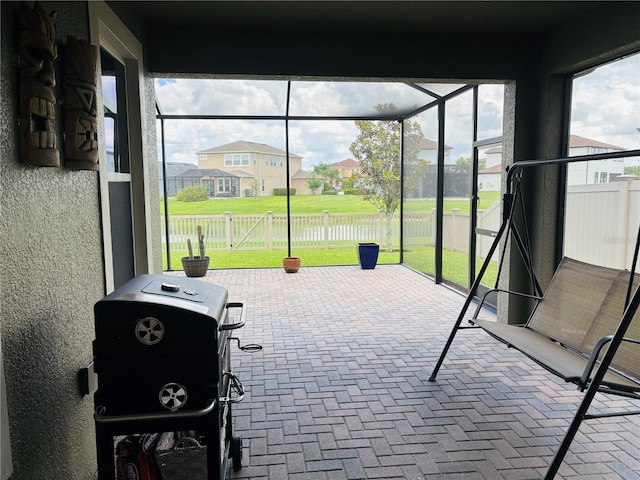 29011 Trevi Pl, Wesley Chapel, FL 33543 - sunroom / solarium featuring a residential view
