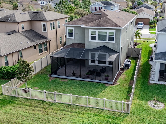 29011 Trevi Pl, Wesley Chapel, FL 33543 - rear view of property featuring a residential view, stucco siding, a fenced backyard, a lanai, and a patio area