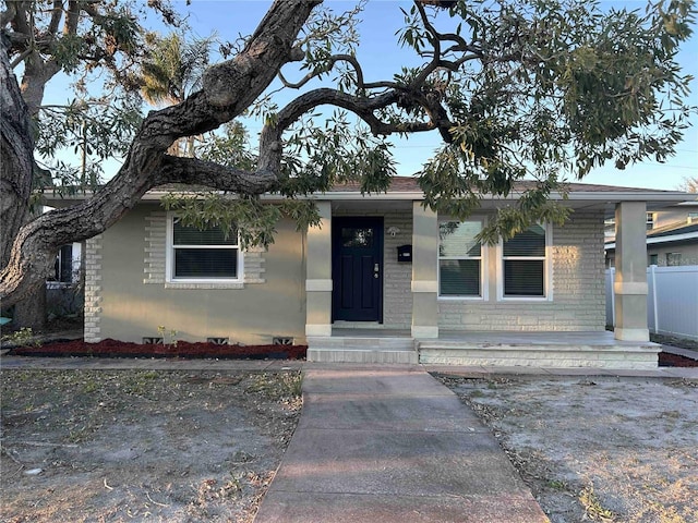 view of front of home with fence