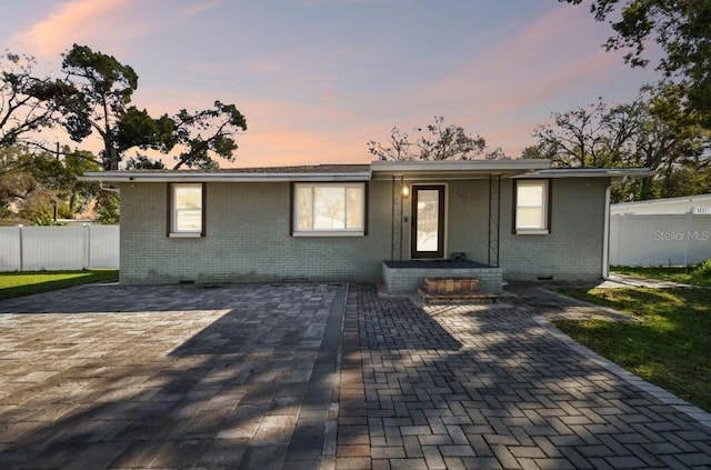 ranch-style house with a patio