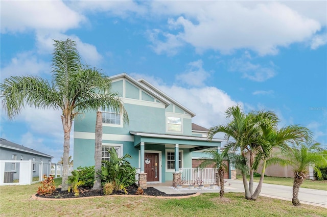 view of front facade featuring a front yard and a porch