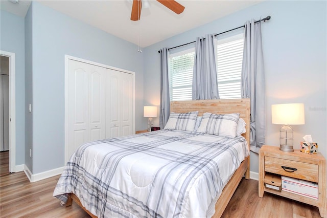 bedroom with a closet, ceiling fan, and hardwood / wood-style flooring