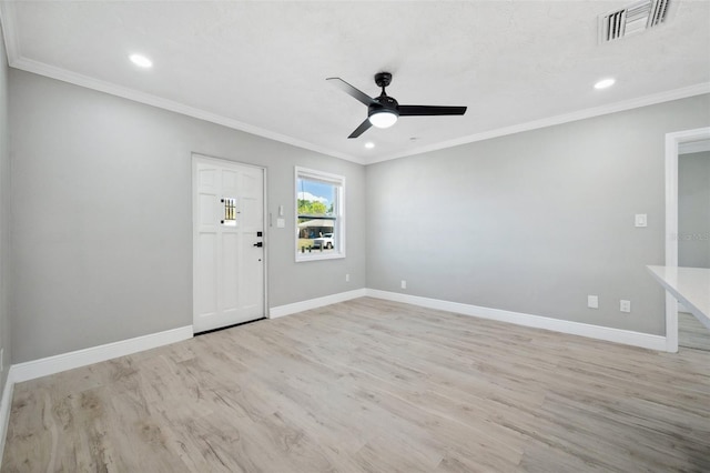 foyer featuring ornamental molding, light wood-type flooring, baseboards, and a ceiling fan