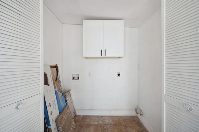 laundry room featuring cabinet space, baseboards, tile patterned floors, washer hookup, and electric dryer hookup