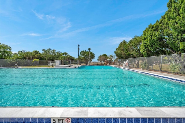 community pool featuring fence