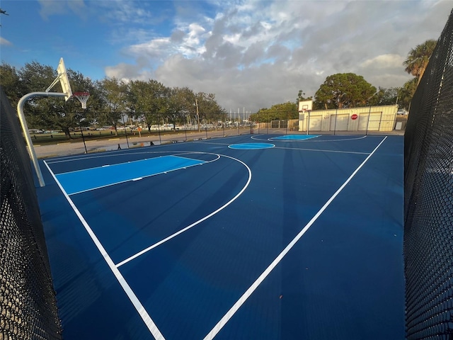 view of basketball court featuring community basketball court and fence