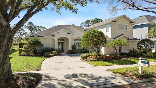 view of front of property with a front lawn