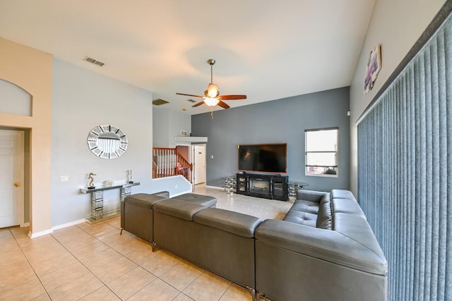 tiled living room with ceiling fan