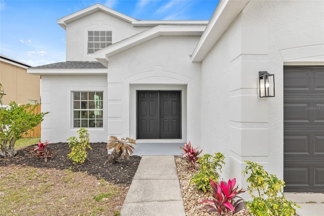 property entrance featuring a garage