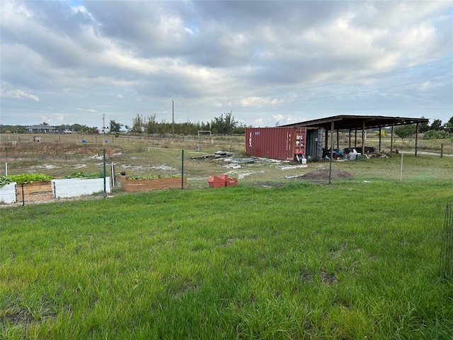 view of yard with a rural view