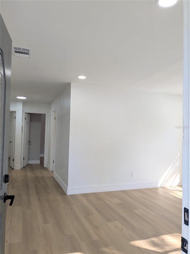 hall with light hardwood / wood-style floors