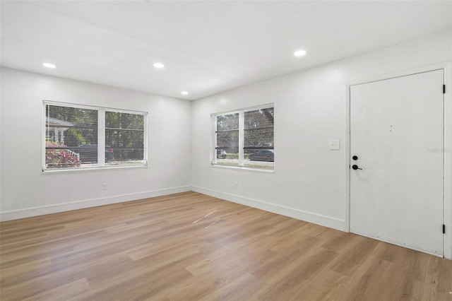 1212 E Crawford St, Tampa, FL 33604 - unfurnished room with plenty of natural light, light wood-type flooring, recessed lighting, and baseboards