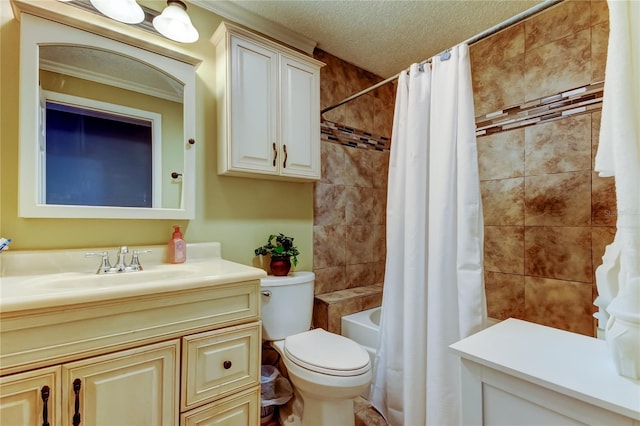 full bathroom featuring shower / tub combo with curtain, vanity, toilet, and a textured ceiling