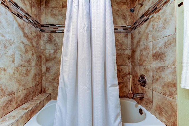 bathroom featuring shower / bathtub combination with curtain