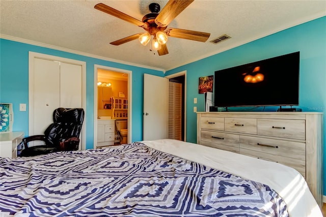 bedroom featuring ensuite bathroom, ceiling fan, a textured ceiling, and ornamental molding