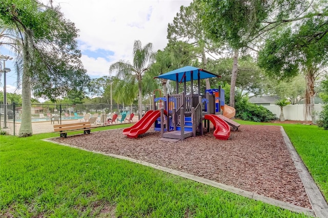 view of play area featuring a lawn