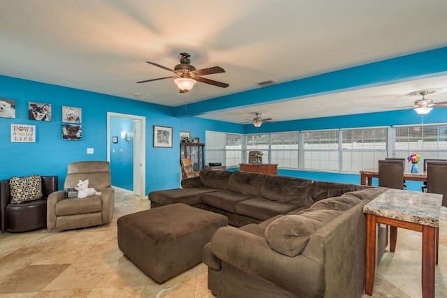 living area with visible vents and a ceiling fan