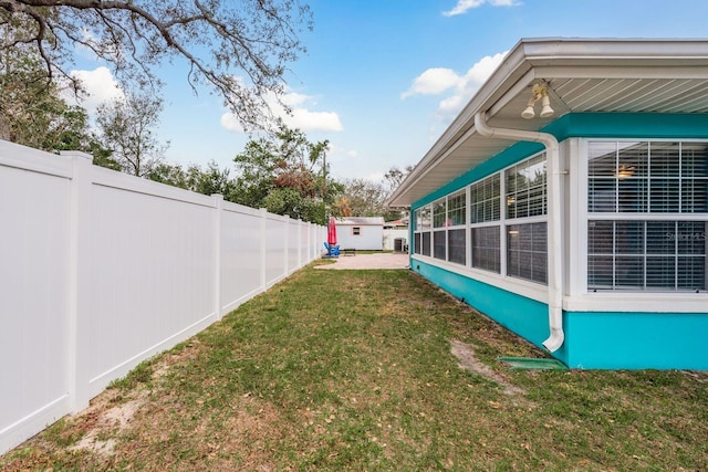 view of yard with a fenced backyard