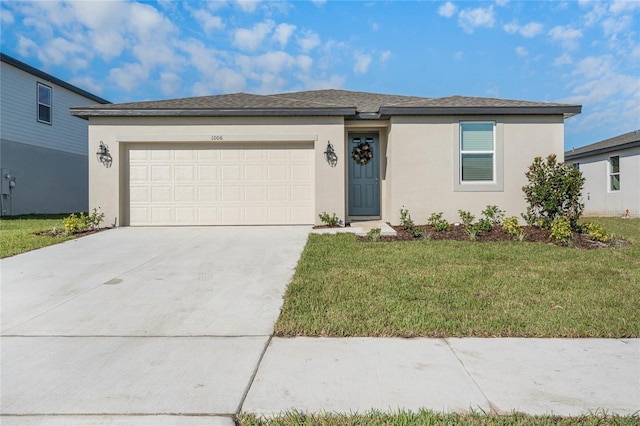 view of front of house with a garage and a front lawn